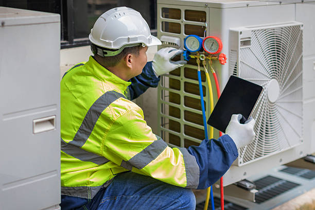 Professional Air Conditioning Repair technician working in Illiopolis, IL
